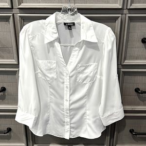 A. Byer cream colored 3/4 sleeve button up blouse.